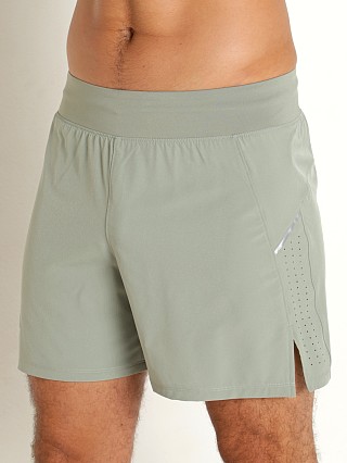 Model in grove green/reflective Under Armour Launch Elite 5" Short