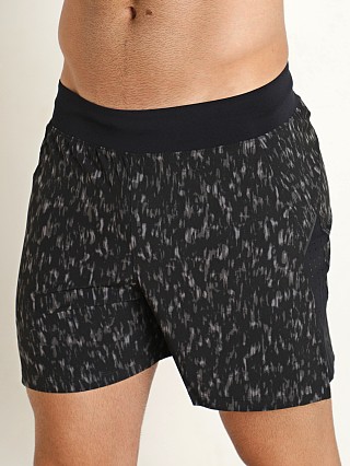 Model in black/reflective Under Armour Launch Elite 5" Short