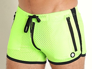 Model in neon green Breedwell Exposer Circuit Shorts