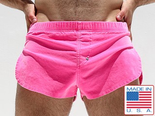 Model in pink Rufskin Lee Stretch Velour Micro Side Split Shorts