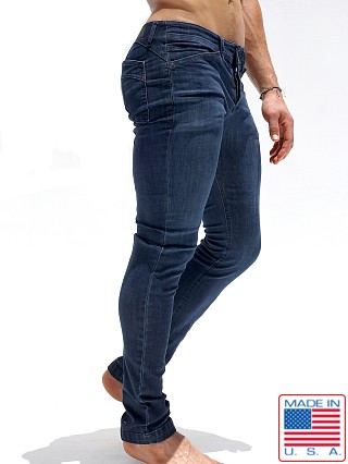 Model in dark distressed Rufskin Reed Slim-Straight Denim Jeans