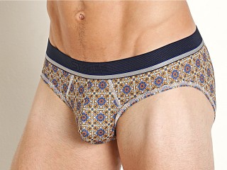 Model in ochre medallion St33le Recycled Polyester Elastane Low Rise Briefs Ochre