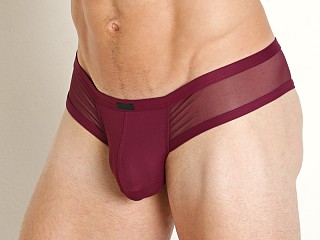 Model in burgundy Manstore Mesh Panel Cheeky Brief