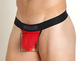 Model in red Mckillop Max Bulge Ultra Stretch Mesh C-Ring Pouch 2.0