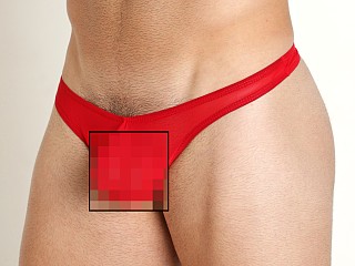 Model in red Mckillop Max Bulge Ultra Stretch Mesh Thong With C-Ring