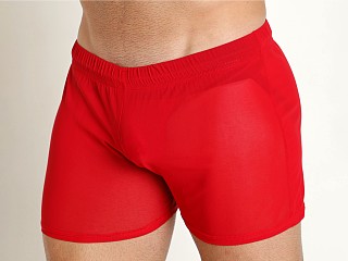 Model in red Mckillop Shade Ultra Stretch Mesh Shorts