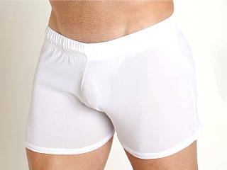 Model in white Mckillop Shade Ultra Stretch Mesh Shorts