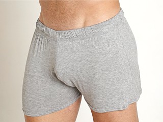 Model in grey Mckillop Shade Whisper Shorts